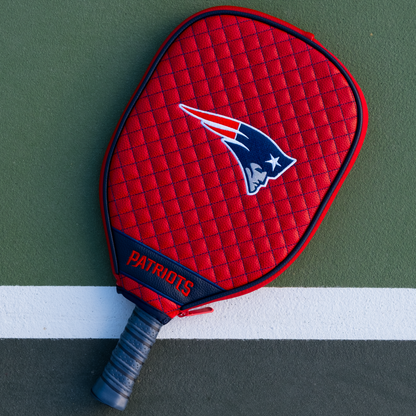 New England Patriots Red quilted pickleball paddle cover on court