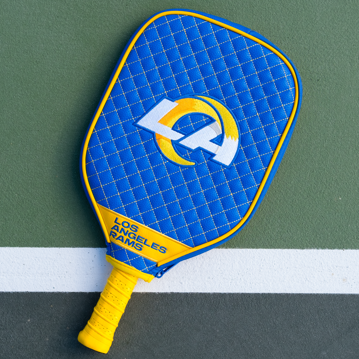 Los Angeles Rams quilted pickleball paddle cover on court view