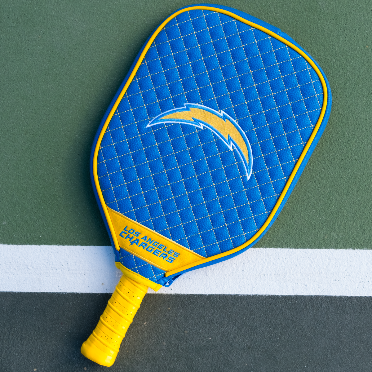 Los Angeles Chargers quilted pickleball paddle cover on court view