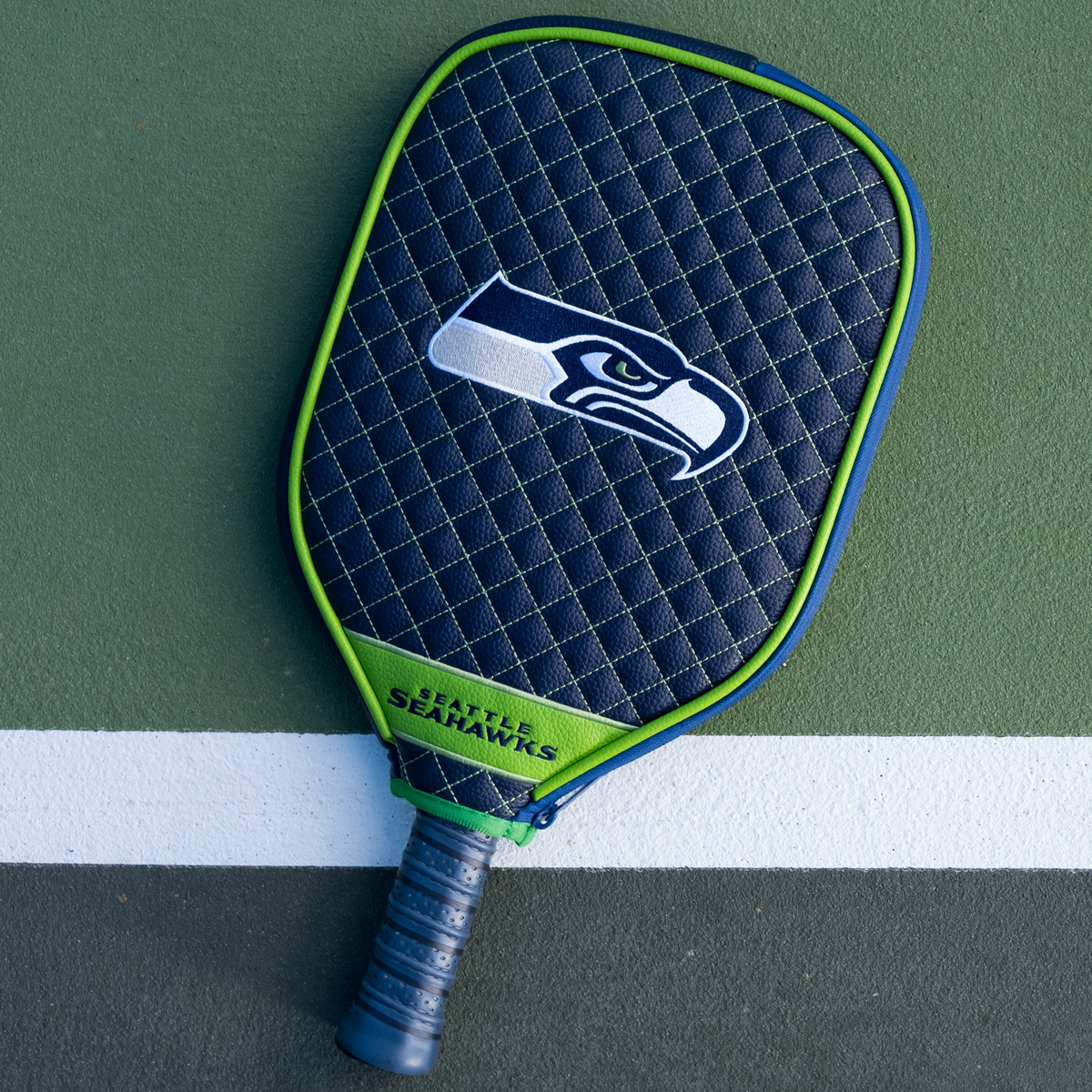 Seattle Seahawks quilted pickleball paddle cover on court view