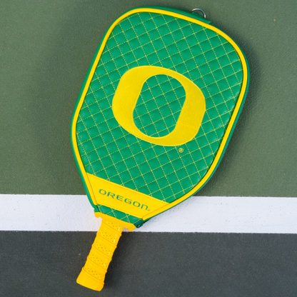 Oregon Ducks quilted pickleball paddle cover on court view