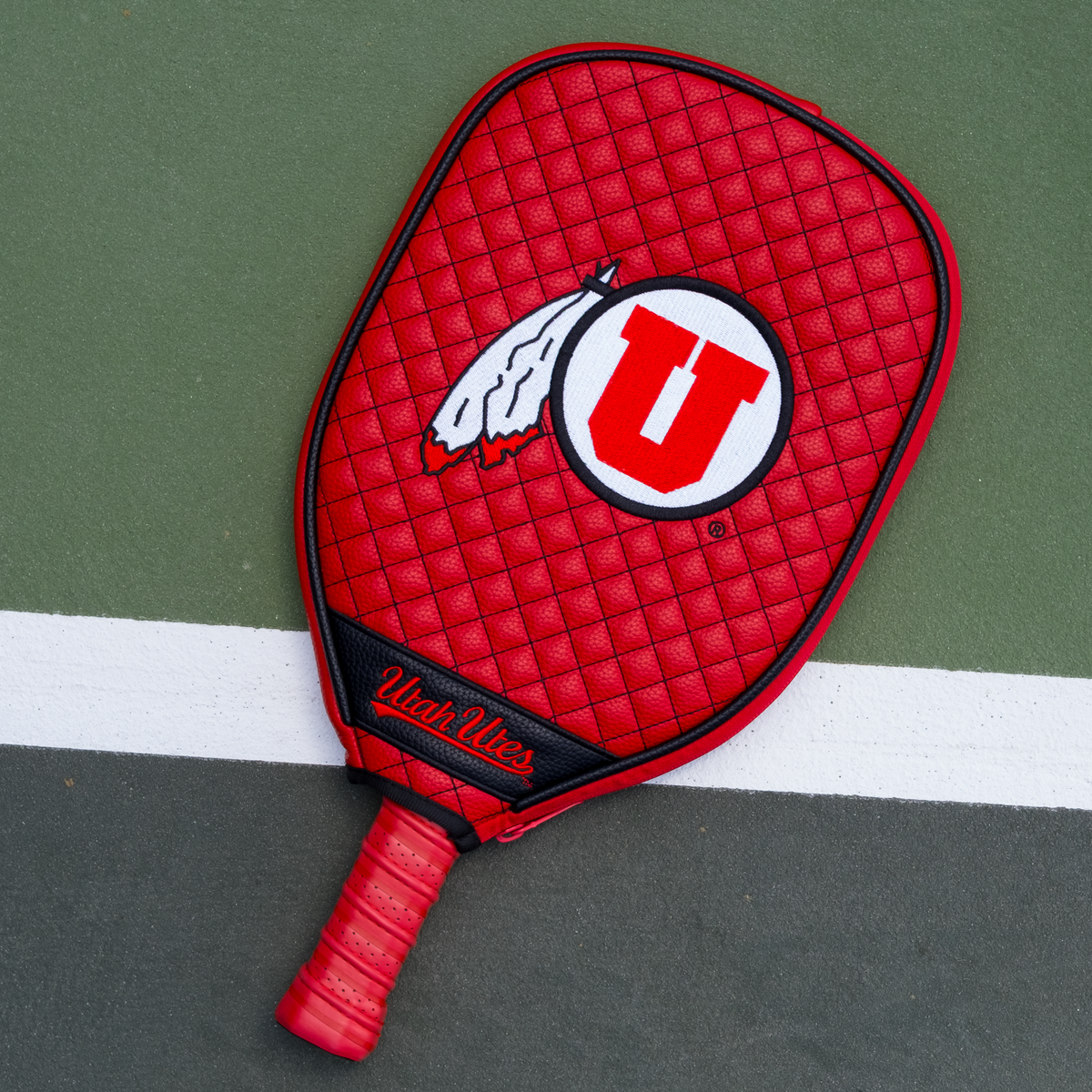 Utah Utes quilted pickleball paddle cover on court view