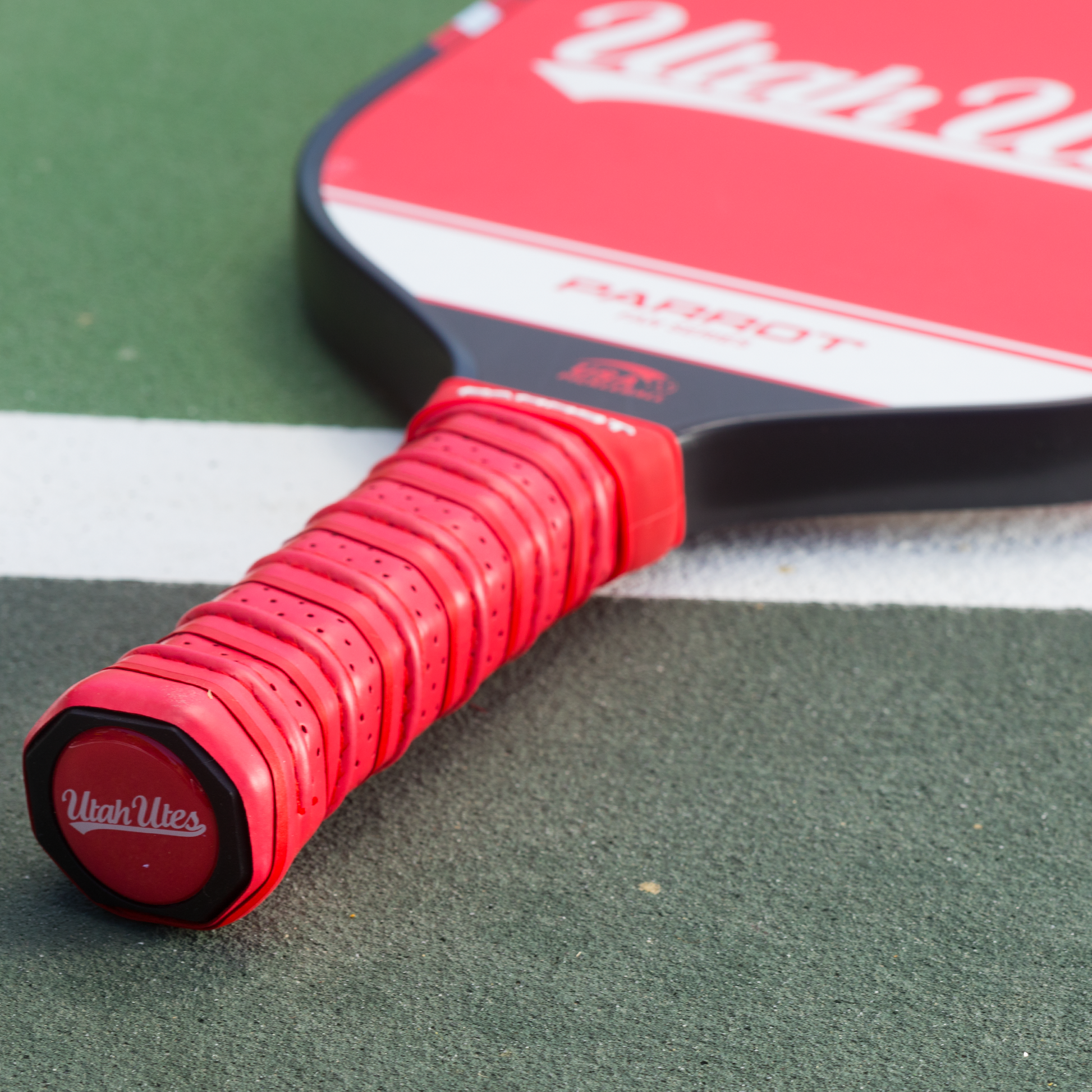 Utah Utes Sport Plus pickleball paddle on the court