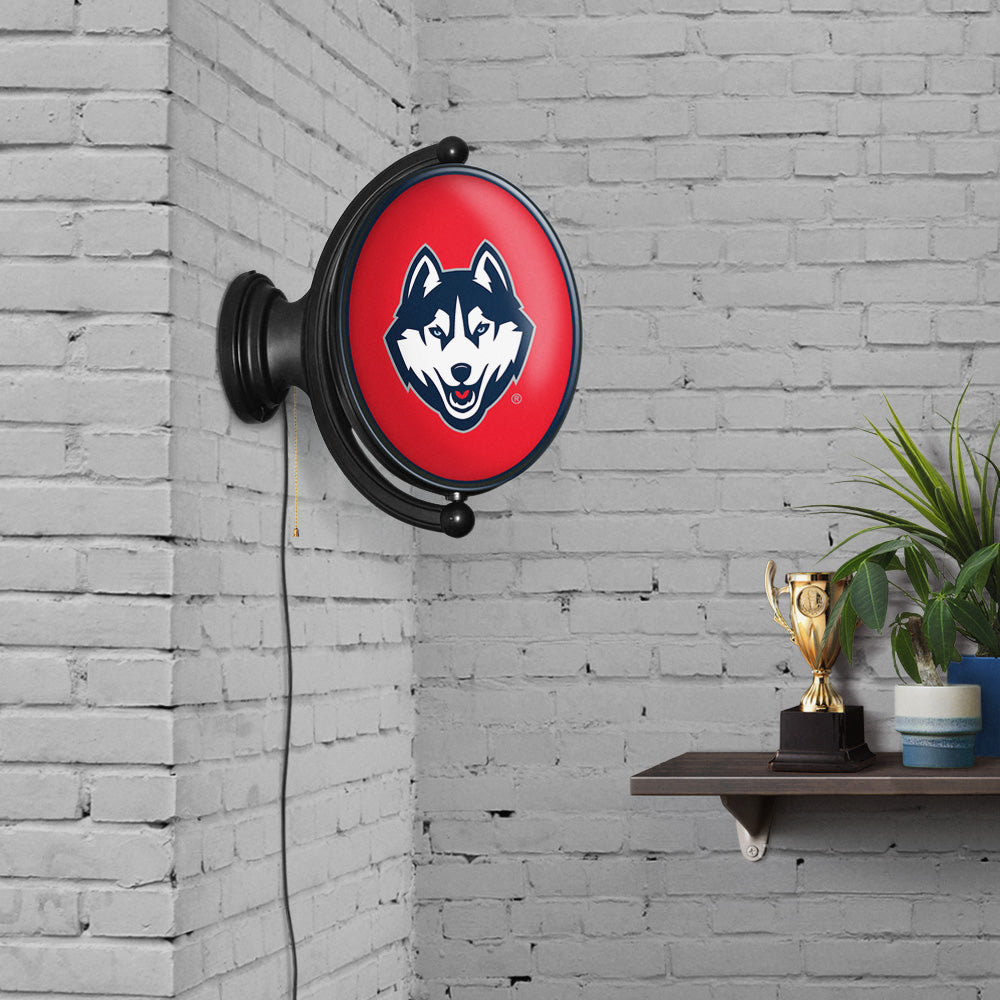 Connecticut Huskies Oval Rotating Wall Sign Room View
